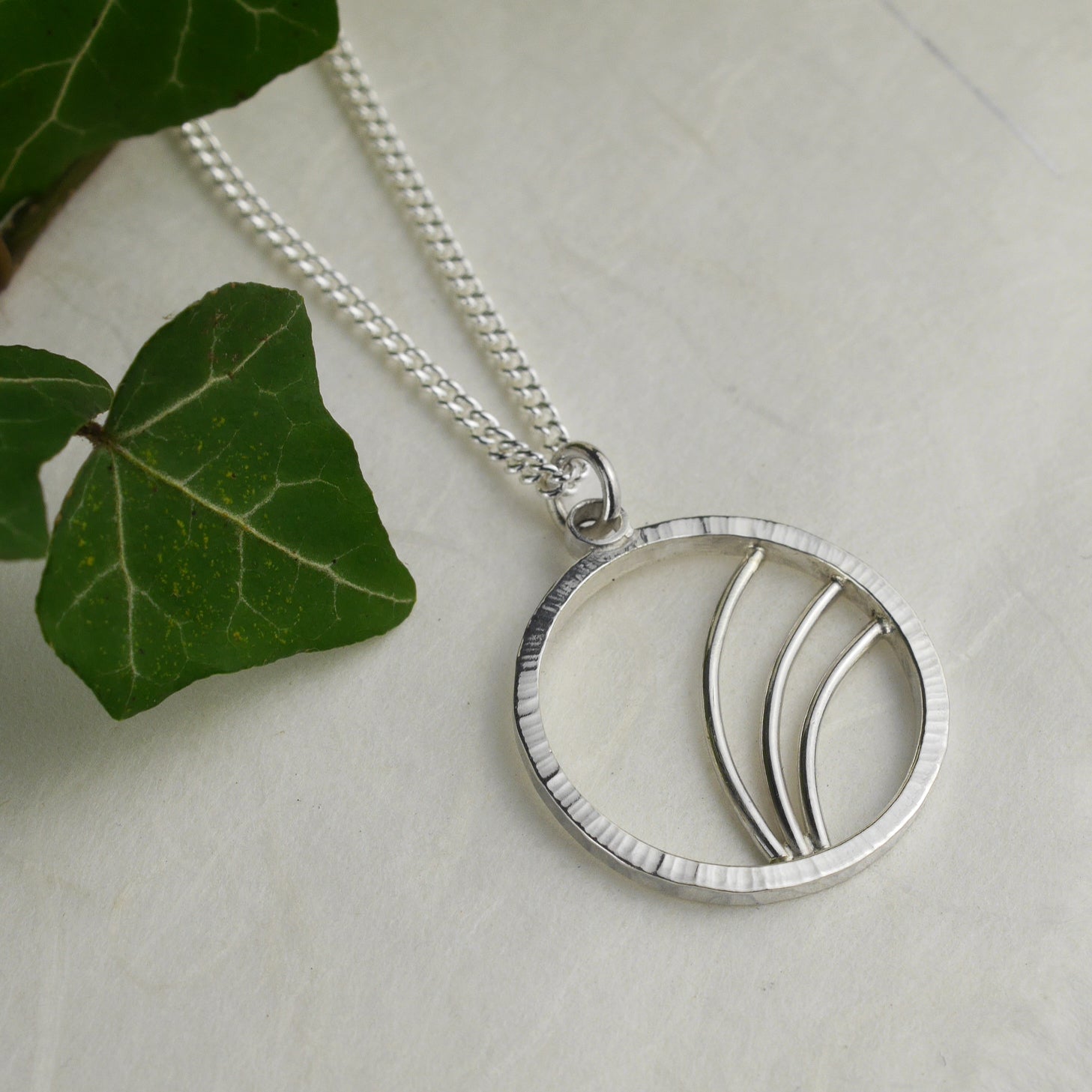 Hammered Silver Circle Necklace with Arc Details