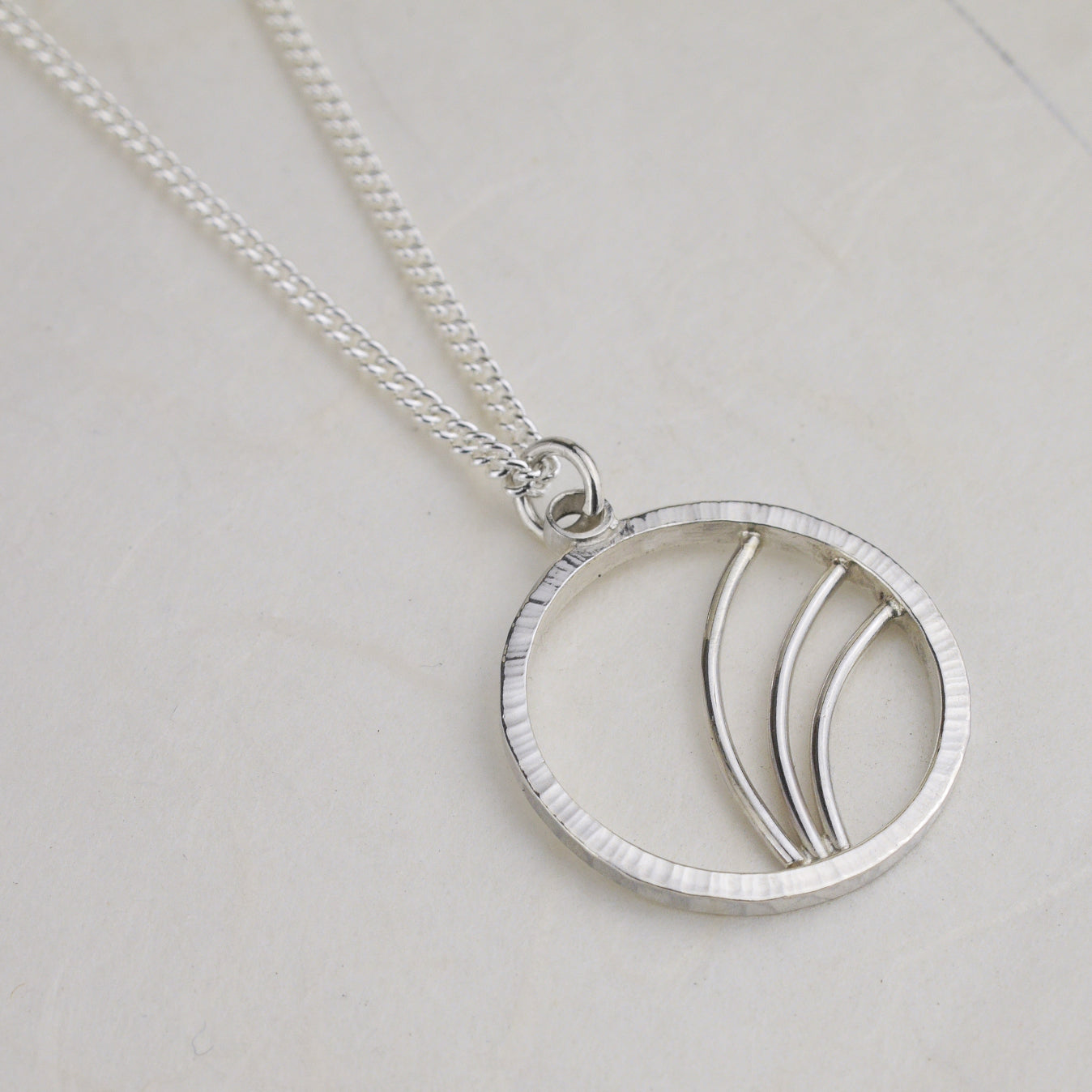 Hammered Silver Circle Necklace with Arc Details